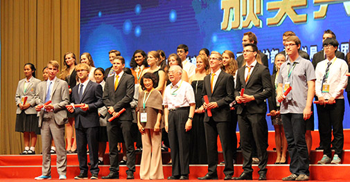 Sebastian Holdum far left in the front row accepted the award on behalf of the trio.